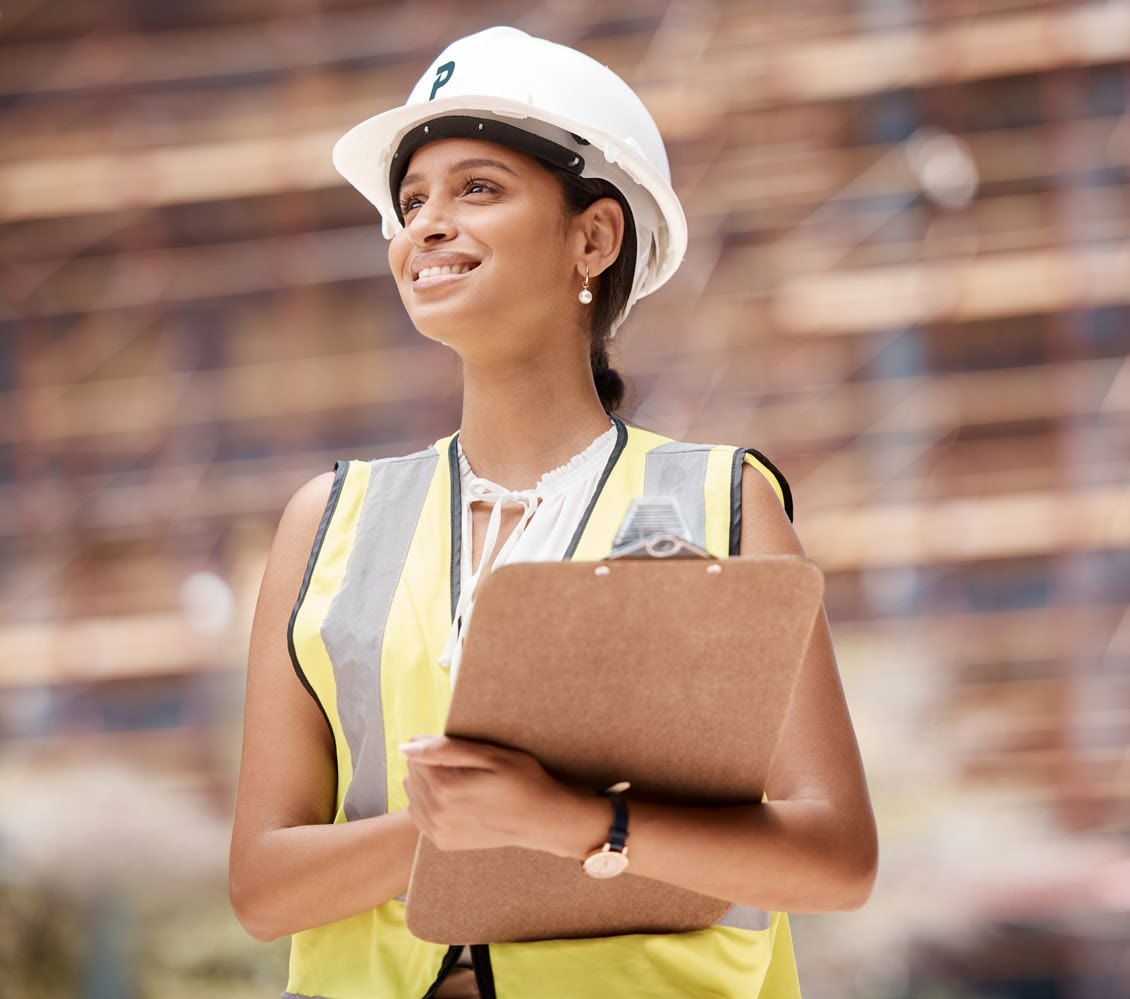 Engineer on site with a clipboard